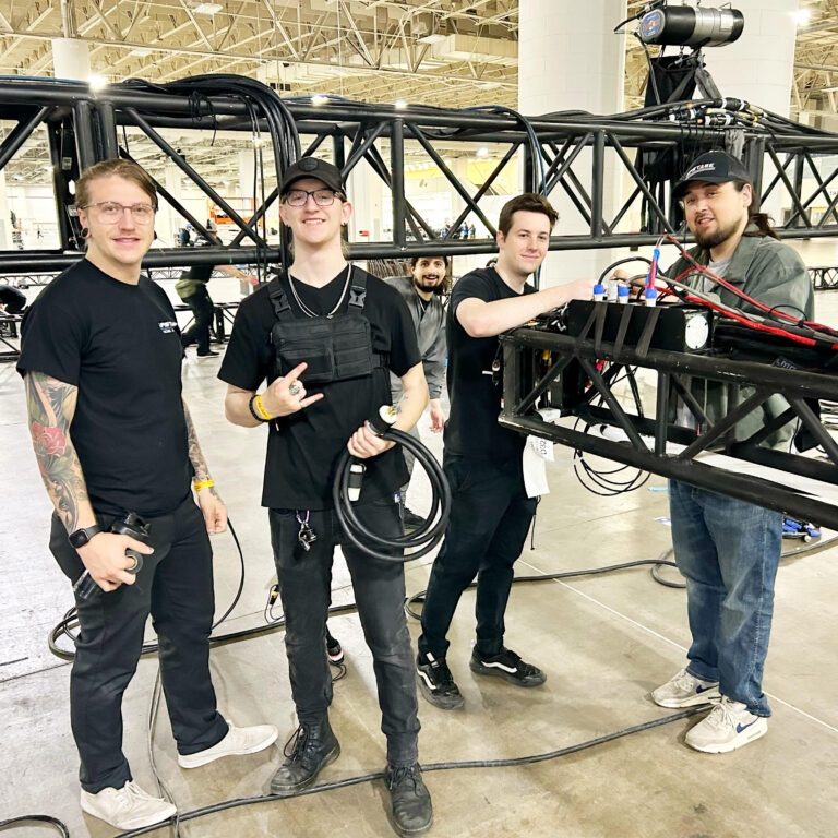 employees assembling stage equipment